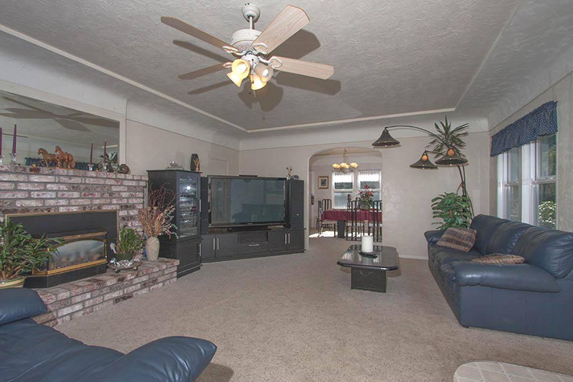 Living room with fireplace open to the dining room
